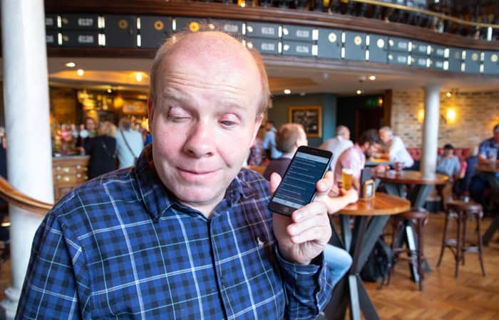 Founder Matt using the Good Food Talks app in a pub