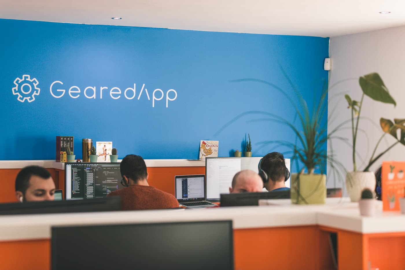 Members of the GearedApp team at their desks in our Edinburgh studio